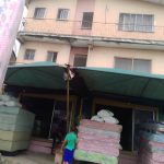 A Two Story building with 4 Nos 3 Bedrooms Flats and a Warehouse on the ground Floor, fenced with a gate. Located at NEPA line, Uyo.